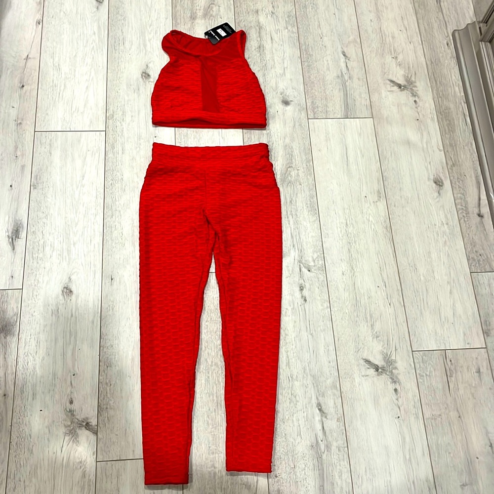 Red two piece semi sheer fineness fit.